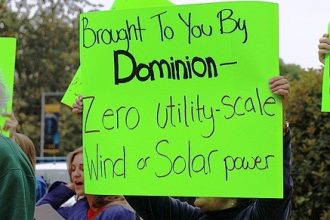 Activists protest in front of Dominion's annual shareholder meeting on May 3.