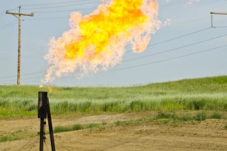 Natural gas flaring at Arnegard, North Dakota oil drilling site