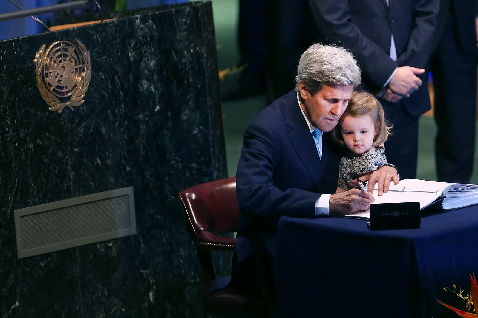 U.S. Secretary of State John Kerry signs the international climate accord