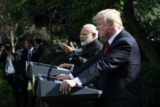 Indian Prime Minister Modi and President Trump make statements outside the White House.