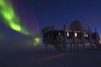 NOAA scientists work at an international observatory in Greenland monitoring the changing ice, shown here with the northern lights. Credit: Christopher Cox/NOAA