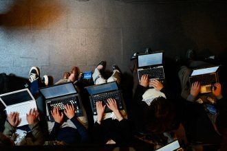 Reporters on laptops. Mark Wilson/Getty Images