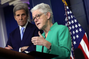 National Climate Adviser Gina McCarthy speaks as Special Presidential Envoy for Climate and former Secretary of State John Kerry listens during a daily press briefing at the James Brady Press Briefing Room of the White House on April 22, 2021 in Washington, DC. Credit: Alex Wong/Getty Images
