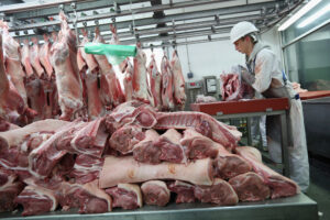 Butchers working for 'G. Lawrence Wholesale Meat' prepare meat for sale in Smithfield Market on March 14, 2013 in London, England. Credit: Oli Scarff/Getty Images