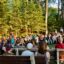 Winona LaDuke welcomes a group of interfaith climate activists to Minnesota on Saturday night at the Northern Pines Camp near Park Rapids. "Thank you for coming," she said. "It doesn't matter what color you are, you have to drink water." Credit: Audrey Gray