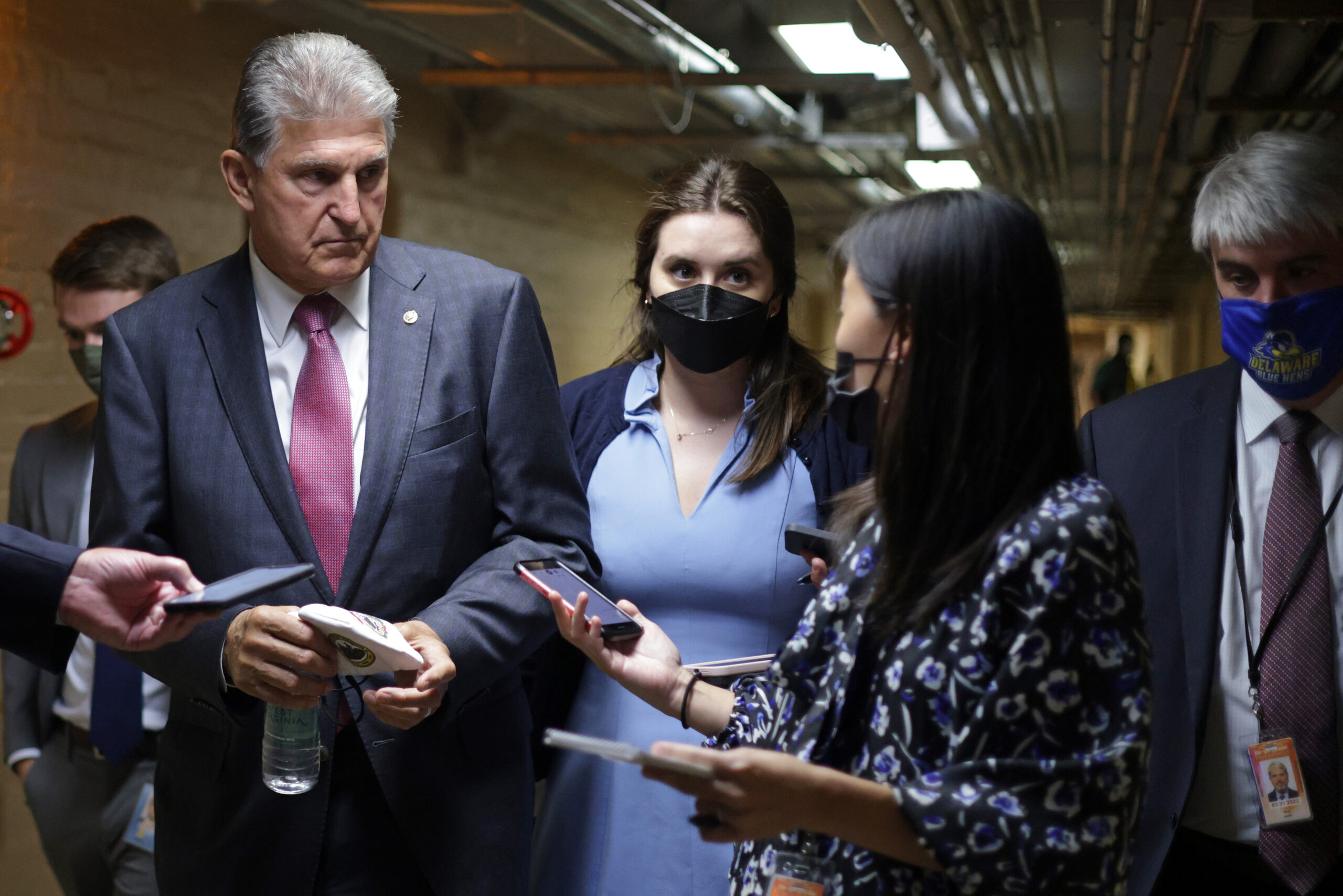 Sen. Joe Manchin (D-W.Va.) talks to members of the press in a hallway at the U.S. Capitol Sept. 28, 2021 in Washington, D.C. Credit: Alex Wong/Getty Images