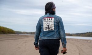 Jean L'Hommecourt visits a river near the Fort McKay First Nation's village about an hour's drive north of Fort McMurray in Alberta, Canada. Credit: Michael Kodas/Inside Climate News