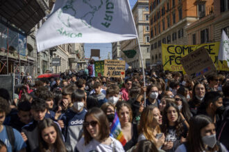 Climate activists take part in a demonstration organized by Friday For Future movement as part of the Global Climate Strike, to call for action against climate change on March 25, 2022 in Rome, Italy. Fridays For Future is a global climate strike movement by students that was started in August 2018 with Swedish pupil Greta Thunberg. Credit: Antonio Masiello/Getty Images