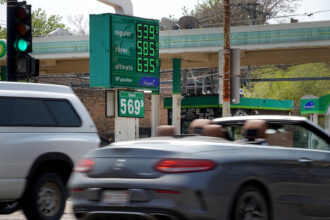 A sign displays gas prices at a gas station on May 10, 2022 in Chicago, Illinois. Credit: Scott Olson/Getty Images
