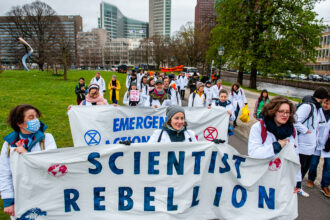 As a part of the climate organization Extinction Rebellion, scientists march through The Hague during the first scientist climate march in The Netherlands on April 6, 2022. Credit: Romy Arroyo Fernandez/NurPhoto via Getty Images