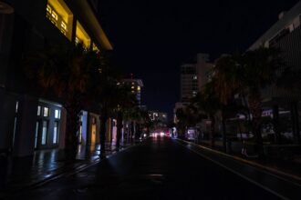 Street lamps are out on a street in the Condado community of Santurce in San Juan, Puerto Rico, on Sept. 19, 2022, after the passage of Hurricane Fiona. Credit: AFP via Getty Images
