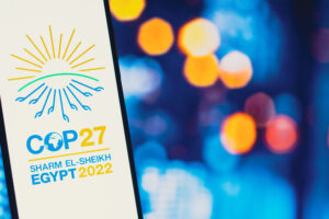 In this photo illustration, the 2022 United Nations Climate Change Conference COP27 logo is seen on a smartphone screen. Credit: Rafael Henrique/SOPA Images/LightRocket via Getty Images