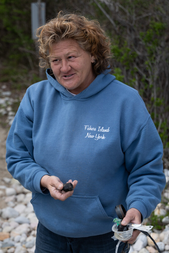 Michele Klimczak during one of her daily cleanups of the beaches of Fisher's Island, New York. Credit: Devin Speak