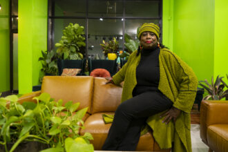 Naomi Davis, an advocate with BlackChicago Water Council, a program of Blacks in Green, sits in the Green Living Room, the Headquarters for Blacks in Green located in the Woodlawn neighborhood, Tuesday, Nov. 9, 2021. Credit: Tyler LaRiviere/Sun-Times