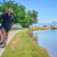 Mark Carrington exits his golf cart to look out on Lake Tamarisk, a man-made lake in Desert Center, Calif., on May 8, 2023. Credit: Alex Gould