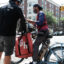 William, an organizer with the Workers Justice Project, speaks to delivery workers outside of a restaurant that uses app deliveries on July 07, 2023 in New York City.