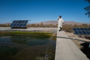 A farmer from Khoshob village walks near his water reservoir near Kandahar airfield, in southern Afghanistan. Credit: Kern Hendricks