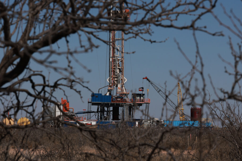 An oil drilling rig works in the Permian Basin oil field in Midland, Texas. Credit: Joe Raedle/Getty Images