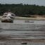 A ferry boat is seen stranded at the Marina do Davi, a docking area of the Negro River in the city of Manaus, Amazonas State, northern Brazil, on October 16, 2023. The Negro River is facing the worst dry season of the last decades in the Amazon rainforest. Credit: Michael Dantas/AFP via Getty Images