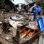 People gather where a home was destroyed by a mudslide as a powerful atmospheric river storm continues to impact Southern California on Feb. 5 in Los Angeles, Calif. Credit: Mario Tama/Getty Images