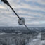 This sensor, made by Heimdall Power, helps the operator of a power line know how much more power can be sent through the line. The eight-pound ball is photographed in Norway. Credit: Heimdall Power