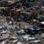 A man walks through debris in Marsh Harbour, Bahamas on Sept. 9, 2019 in the aftermath of Hurricane Dorian. Credit: Carolyn Van Houten/The Washington Post via Getty Images