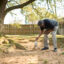 Ricky Jordan inspects an abandoned well with a temporary cap in the backyard of a home on March 8, 2023 in Oil City, La. Credit: Cooper Neill/The Washington Post via Getty Images