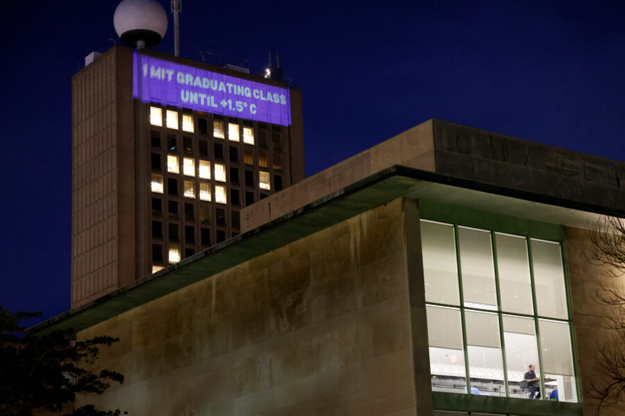 MIT students project a climate clock onto the university's Green Building, the tallest in Cambridge. Credit: Jessica Rinaldi/The Boston Globe via Getty Images