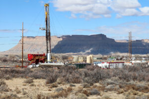 Trucks pump and haul spilled water away from a test mining drill site on March 8 in Green River, Utah. Residents are worried over how the Direct Lithium Extraction mine—and any spills caused by it—could impact local water supplies. Credit: Kelly Dunham