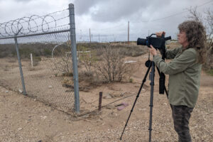 Sharon Wilson of Oilfield Witness sets up her Optical Gas Imaging camera outside a ONEOK compressor station near the Waha Hub in Pecos County, Texas on March 16. Credit: Martha Pskowski/Inside Climate News