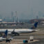 One World Trade Center in New York City is obscured amid poor air quality due to smoke from Canadian wildfires as planes sit on the tarmac at Newark Liberty International Airport on June 8, 2023 in New Jersey. Credit: Eduardo Munoz Alvarez/Getty Images