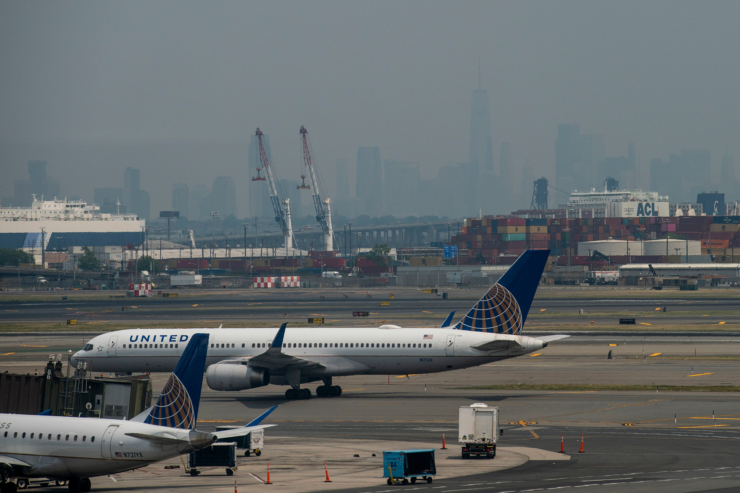One World Trade Center in New York City is obscured amid poor air quality due to smoke from Canadian wildfires as planes sit on the tarmac at Newark Liberty International Airport on June 8, 2023 in New Jersey. Credit: Eduardo Munoz Alvarez/Getty Images