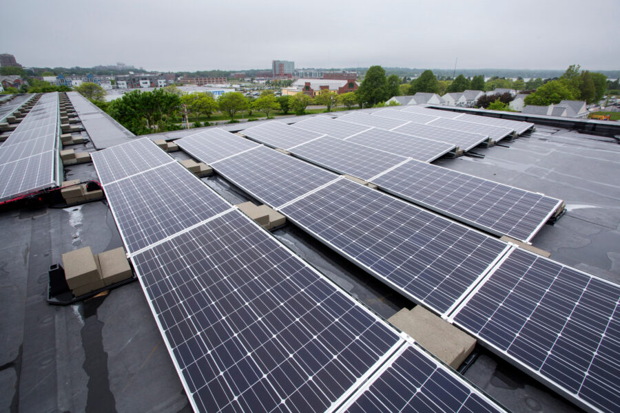This rooftop houses 167 solar electric panels which supply energy a 45-unit apartment complex in Portland, Maine. Credit: Derek Davis/Portland Portland Press Herald via Getty Images