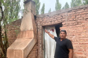 Andres Duran, a Sauzal Bonito resident, points to a crack in his chimney that he says was caused by fracking-induced earthquakes.