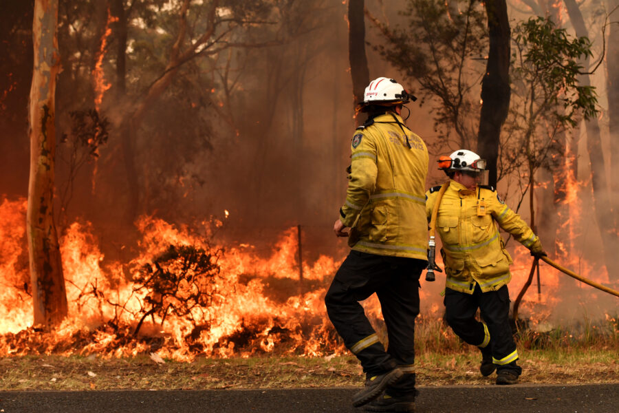 Rural Fire Service firefighters are seen by containment lines at the Three Mile Fire during “Black Summer” on the Central Coast of Australia in December 2019. Studies have examined the psychological impacts of the unprecedented bushfire season. Credit: Sam Mooy/Getty Images