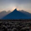 The sun sets behind the mountains at Grand Teton National Park in Wyoming, shrouded in smoke from regional wildfires on July 14, 2021. Credit: Natalie Behring/Getty Images