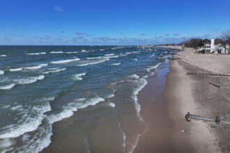 An aerial view shows waves rolling along the shore of Lake Michigan in Whiting, Indiana. Credit: Scott Olson/Getty Images