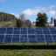 An array of solar panels is seen near a dairy farm in St George, Vermont. Credit: Robert Nickelsberg/Getty Images