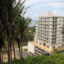 Honduras Próspera built a 14-story mixed-use tower perched at the bottom of a once-forested hillside near Crawfish Rock, a fishing village of a few hundred people on the island of Roatán. Credit: Nicholas Kusnetz/Inside Climate News
