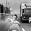 A commuter wears a “slightly satiric” gas mask in Los Angeles in 1966. By the 1940s, smog from vehicle exhaust had gotten so bad that the county formed the nation’s first air pollution control district. Credit: Herald Examiner Collection/Los Angeles Public Library