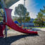 Three-year-old Layla glides down a slide at Kiwanis Park on a hot day in August in Tempe, Arizona. Credit: Kevin Hurley/Inside Climate News