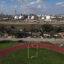 A view of Deer Park Stadium with refineries in the background in Deer Park, Texas. Credit: Mark Felix/The Texas Tribune