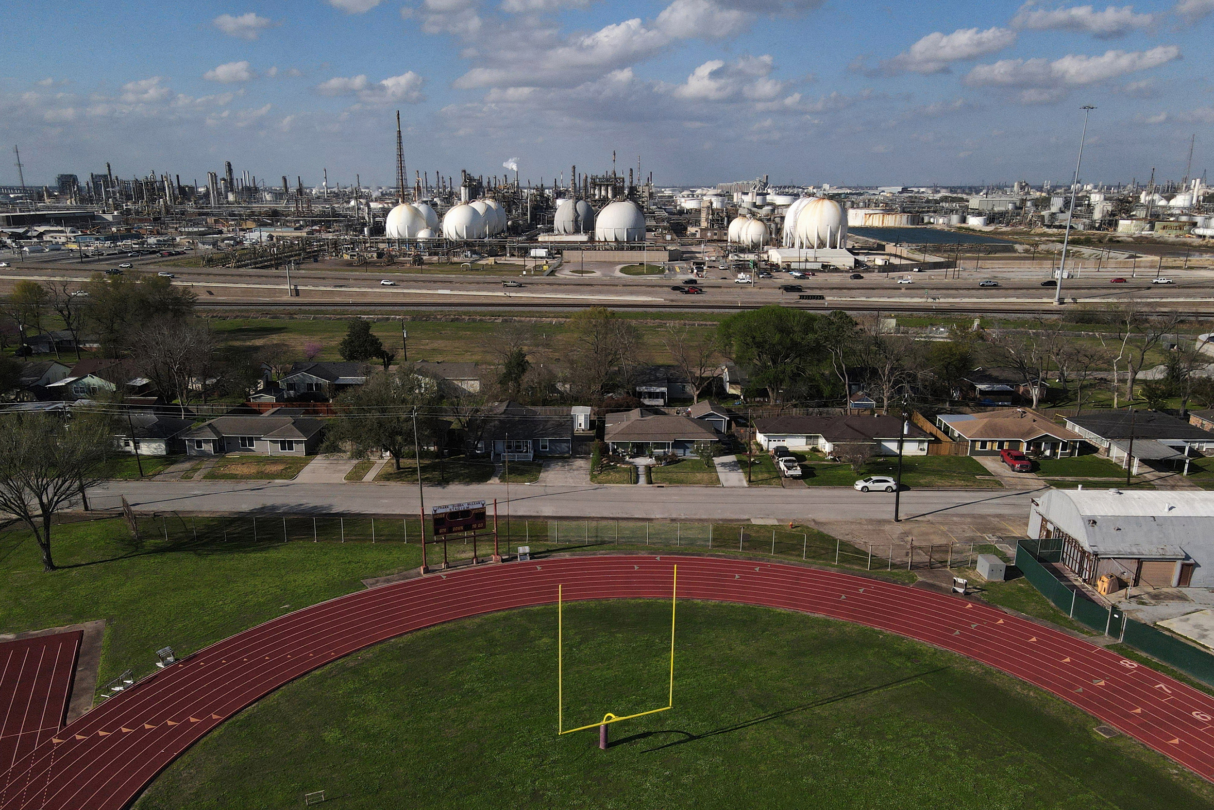 A view of Deer Park Stadium with refineries in the background in Deer Park, Texas. Credit: Mark Felix/The Texas Tribune