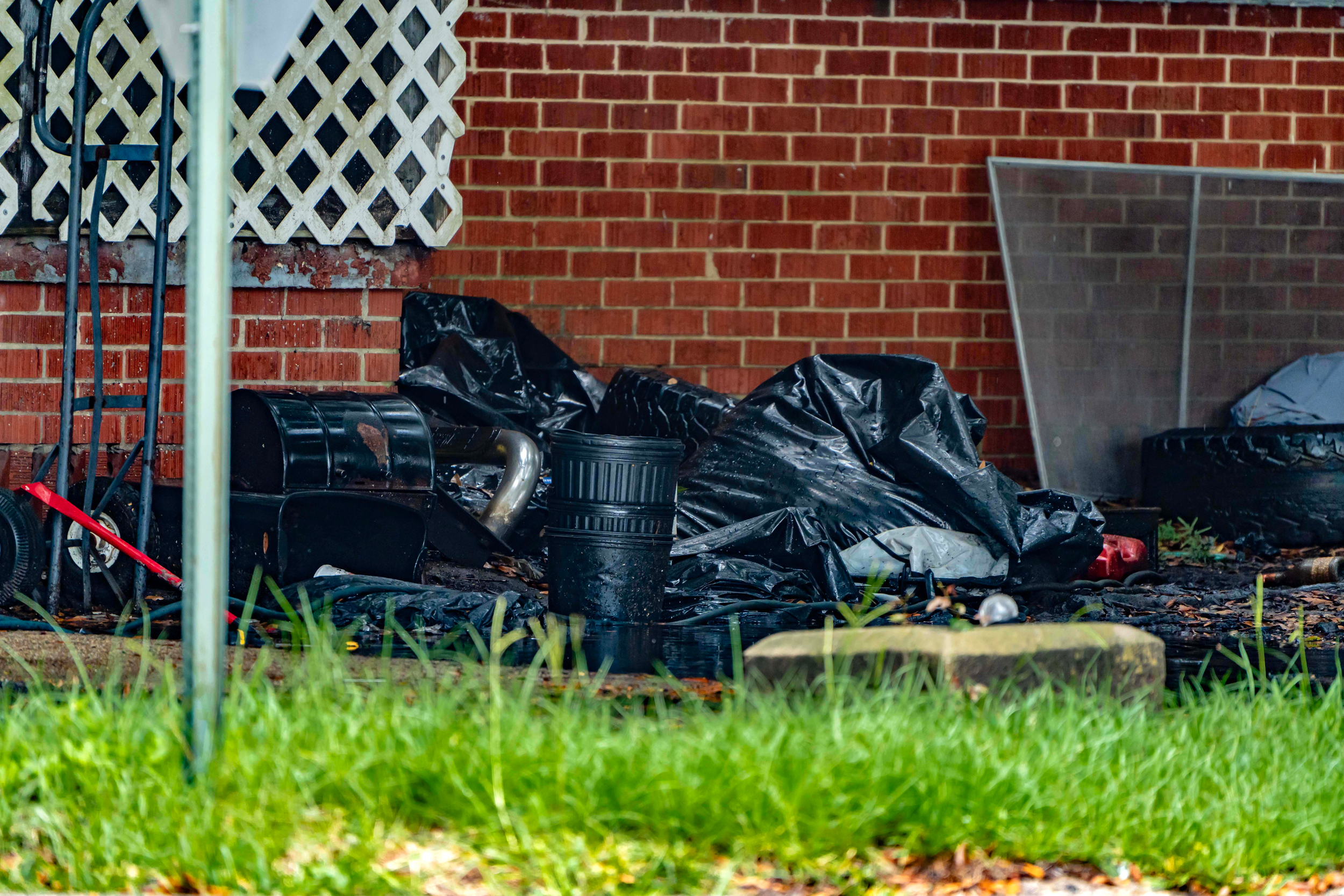 Garbage collected in bags piles up outside of a home in Chickasaw, Ala. Credit: Lee Hedgepeth/Inside Climate News