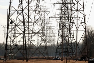 Power transmission towers run along the Indiana-Illinois border in Hammond, Ind. Credit: Scott Olson/Getty Images