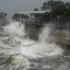 Waves crash along a pier in St. Petersburg, Fla. as Hurricane Milton made landfall on Wednesday night. Credit: Bryan R. Smith/AFP via Getty Images