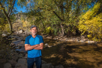 Gary Wockner, founder of the nonprofit Save the Colorado, stands in front of Boulder Creek on Oct. 22 in Boulder, Colo. Wockner's group has been fighting an expansion of the Gross Reservoir west of Boulder. Credit: Michael Kodas/Inside Climate News