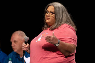 Lisa Lindsay addresses her neighbors in August 2024 during the first Oak Grove community meeting since the March explosion. Credit: Lee Hedgepeth/Inside Climate News