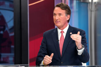 Virginia Gov. Glenn Youngkin speaks during "Fox & Friends" at Fox News Channel Studios on Oct. 10 in New York City. Credit: John Lamparski/Getty Images