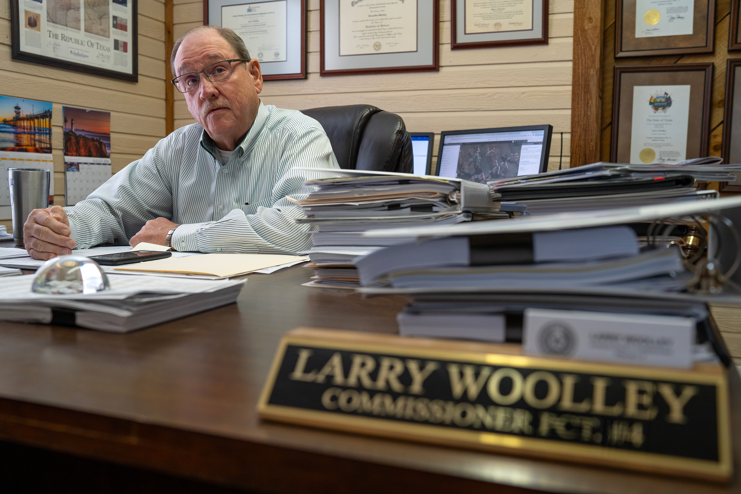 Johnson County Commissioner Larry Woolley at his desk in Cleburne. Credit: Azul Sordo for The Texas Tribune